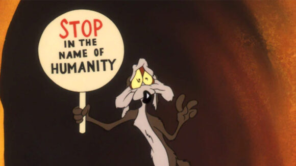 Wile E. Coyote holding sign